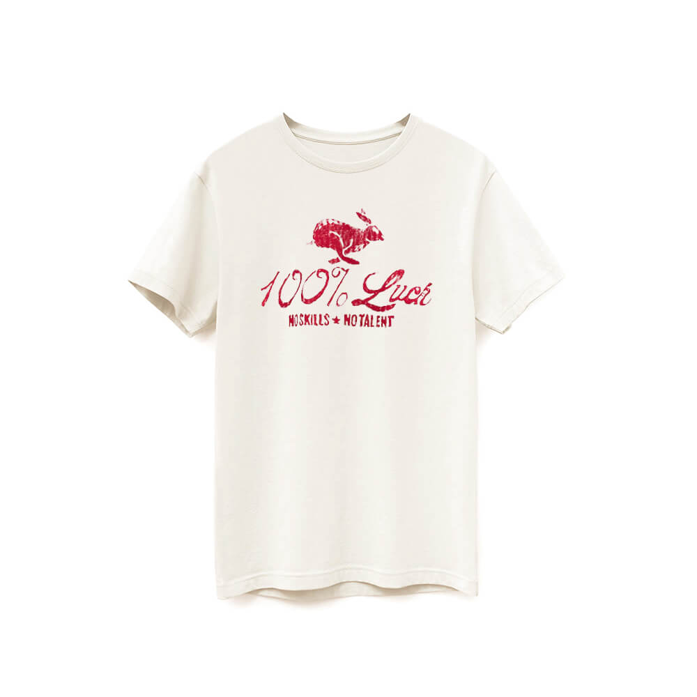 Natural white color t-shirt with red artwork of a rabbit with the words: "100% Luck. No Skills. No Talent" below the rabbit.