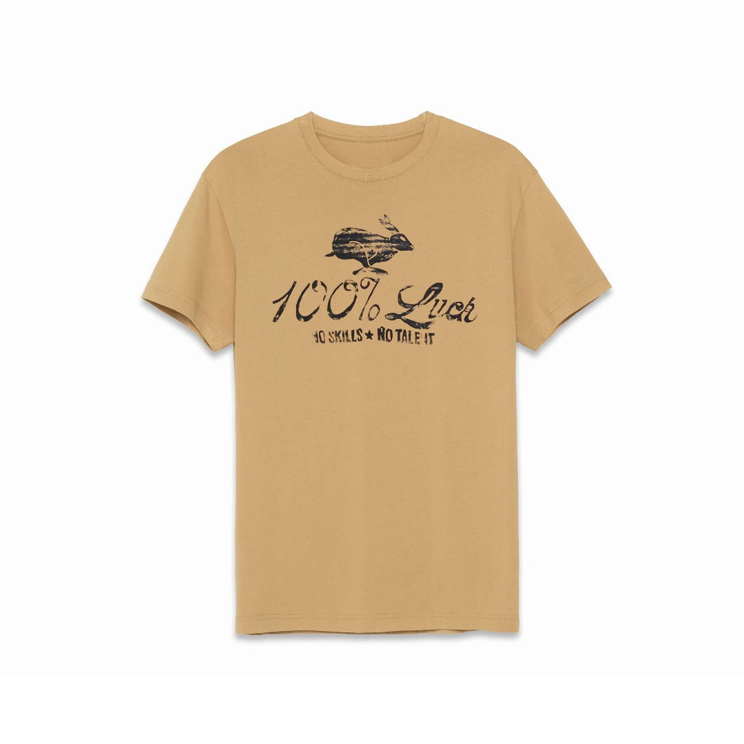 Tan color t-shirt with black artwork of a rabbit with the words: "100% Luck. No Skills. No Talent" below the rabbit.