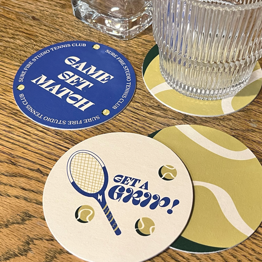 Pulpboard coasters with trendy, tennis-inspired designs.